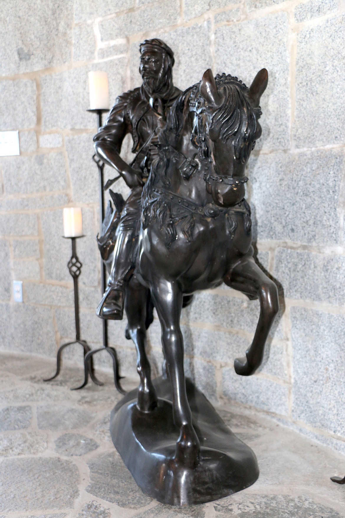 A statue of a knight on horseback adds ambience at Castle Von Frandsen.
