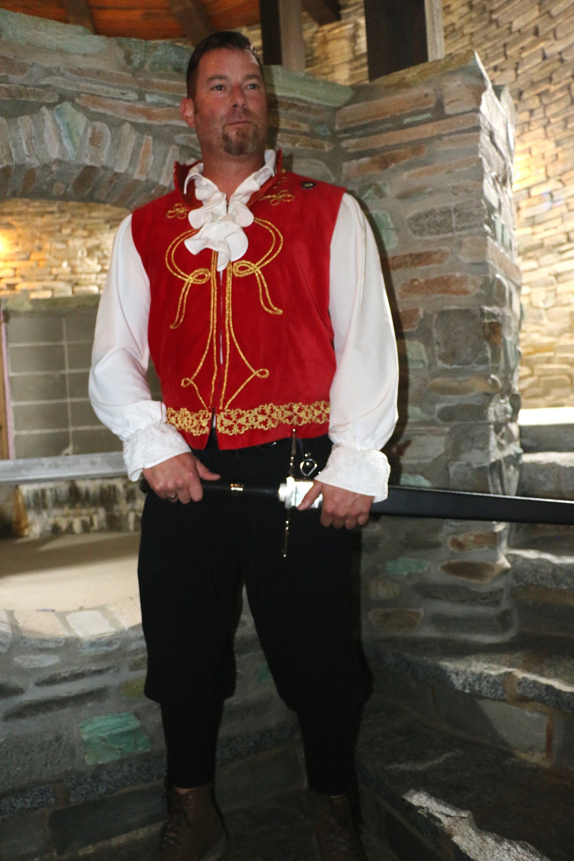A member of the Sandpoint Renaissance Faire welcomes guests to a gala event at the castle.