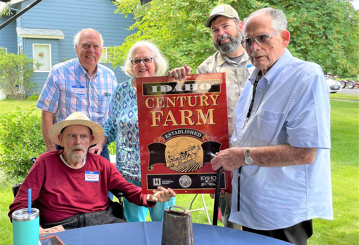 Photo courtesy Kootenai County Board of Commissioners
Don Pischner, Idaho Historical Society trustee, presents the J.P Johnson family with the Idaho Century Farm Award on Saturday. Standing from left, Pischer, Virginia Johnson, Brett Donald Gilbert, and Maurice Johnson. Seated is Graydon Johnson.