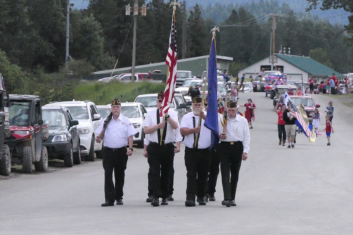 The colors are paraded down mainstreet in Noxon by the local VFW as the 2022 parade got underway.  (Chuck Bandel/VP-MI)