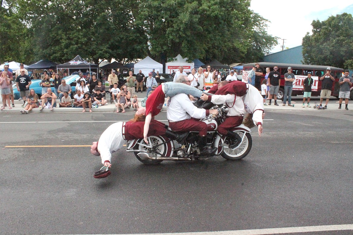 The Seattle Cossacks motorcycle stunt team does the apparently impossible during the group’s performance at Summerfest in Royal City Saturday.