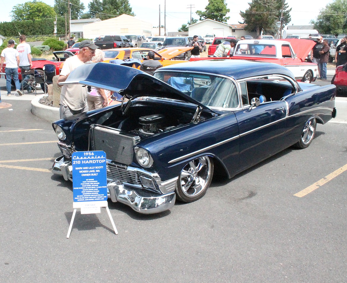 Marv Scott of Moses Lake buffs his 1956 Chevy at the car show at Royal City’s Summerfest Saturday.