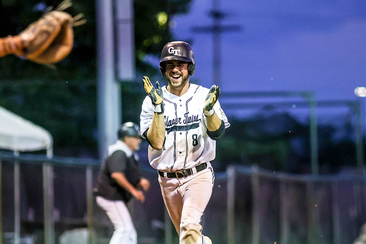 Mason Peters celebrates a score before crossing home plate at Memorial Field on Thursday. (JP Edge photo)