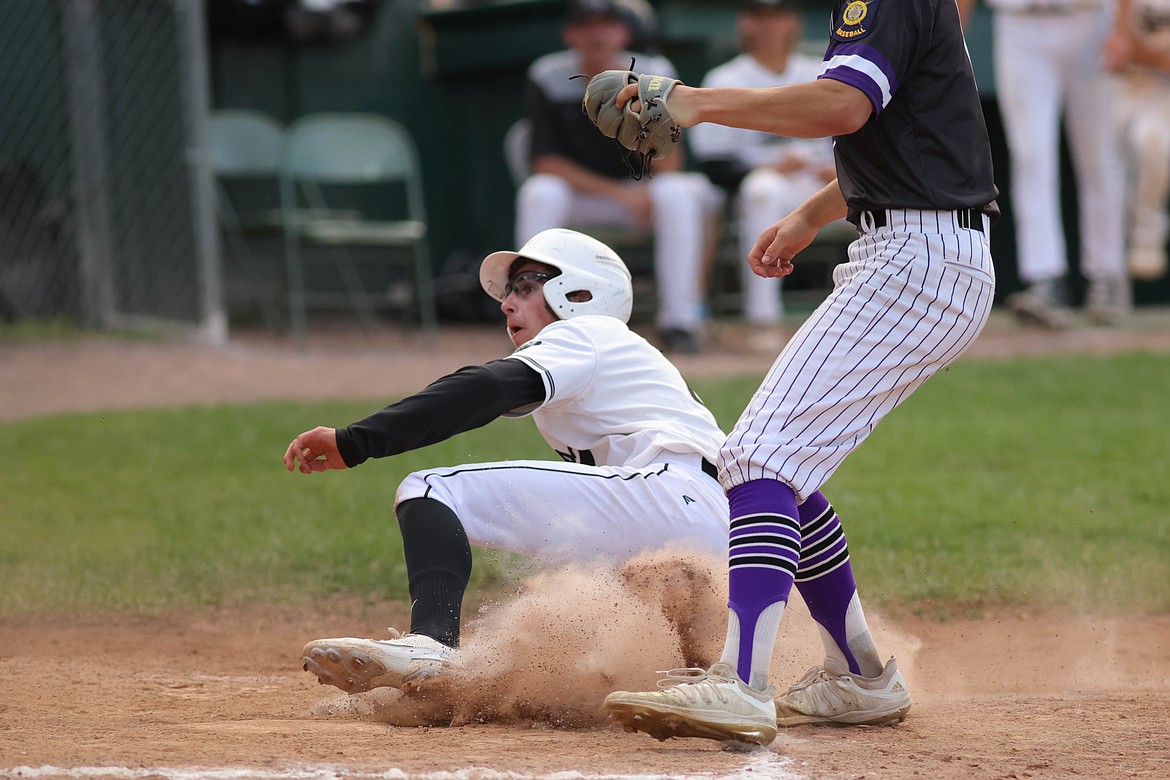 Hayden Meehan slides into home plate at Memorial Field on Thursday. (JP Edge photo)