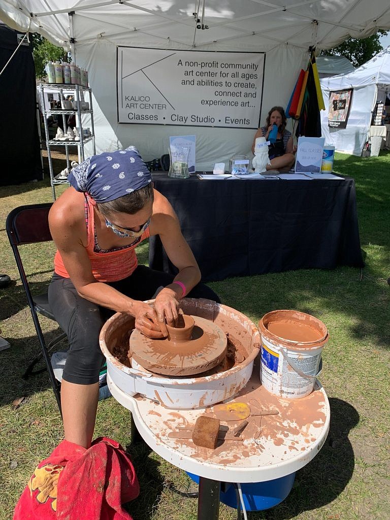 An artist works on a pottery wheel at Arts in the Park. - Inter Lake file photo