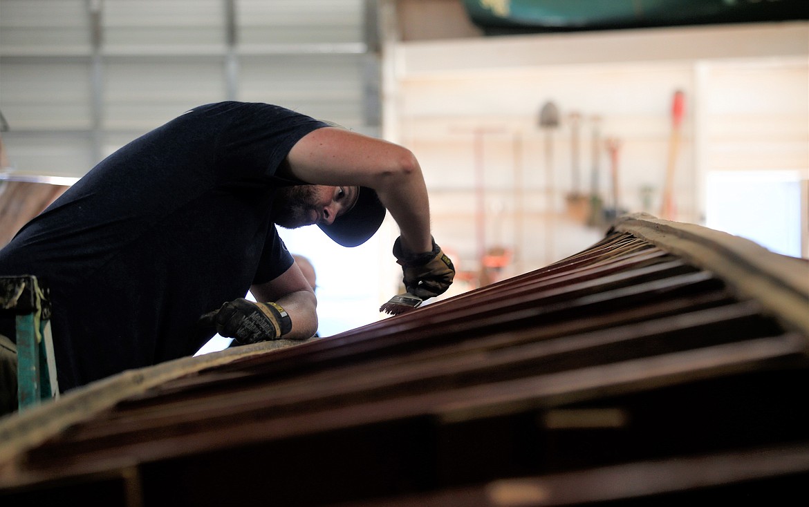 Colin Anderson prepares a 1937 Chris-Craft for a new double hull.