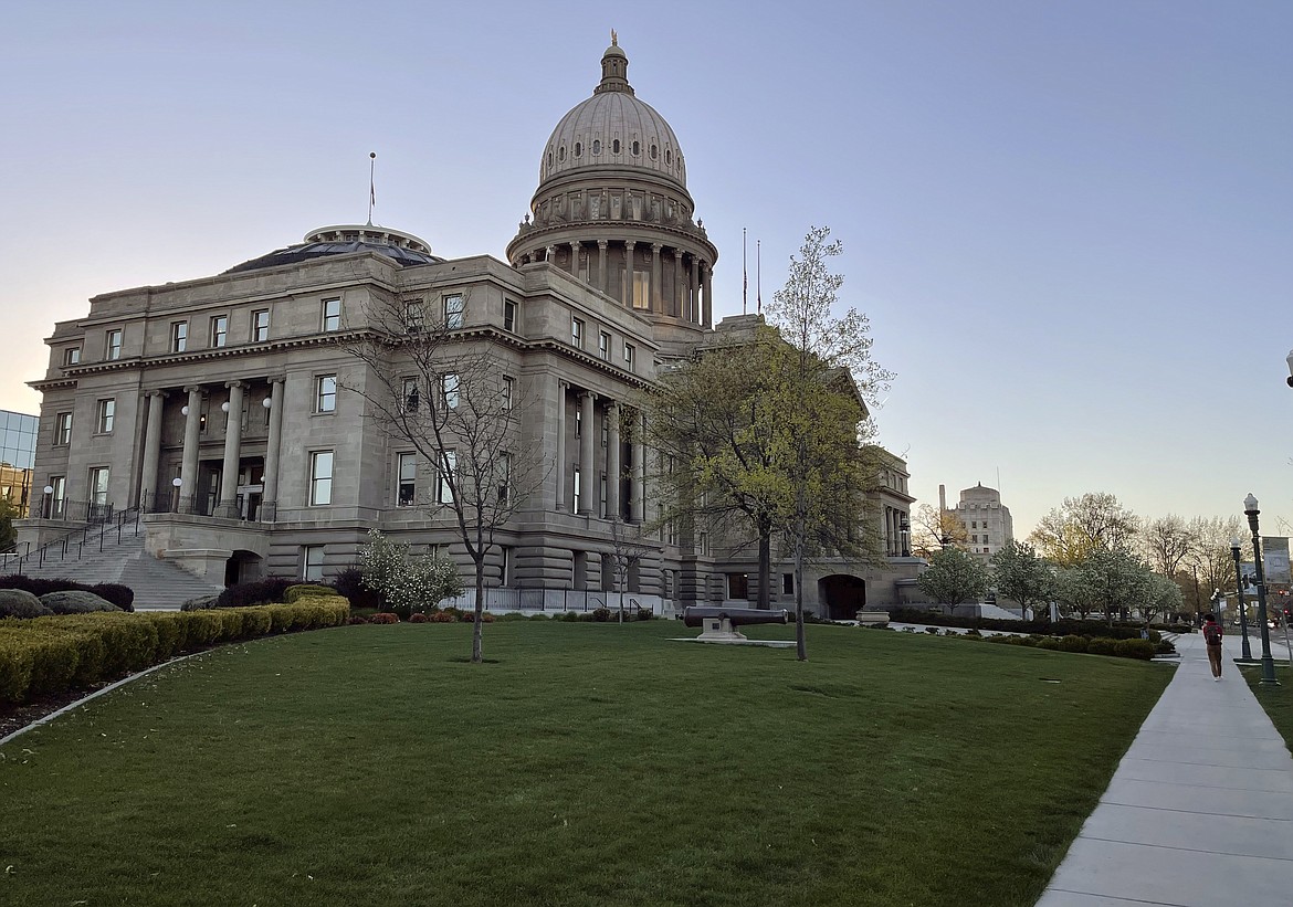 The Idaho Statehouse is seen at sunrise on April 20, 2021, in Boise, Idaho. The Idaho Republican Party will consider 31 resolutions at its three-day convention starting Thursday, July 14, 2022, including one already adopted by Texas Republicans that President Joe Biden isn't the legitimate leader of the country. (AP Photo/Keith Ridler, File)