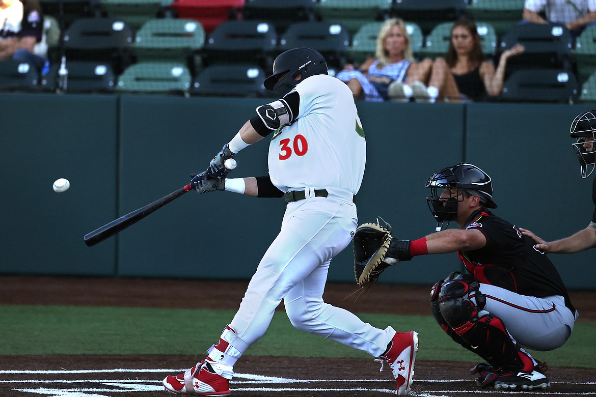 Range Riders' third baseman Dean Miller launches a pitch to left field for a home run in the second inning against Billings at Flathead Field on Thursday, July 14. (Jeremy Weber/Daily Inter Lake)