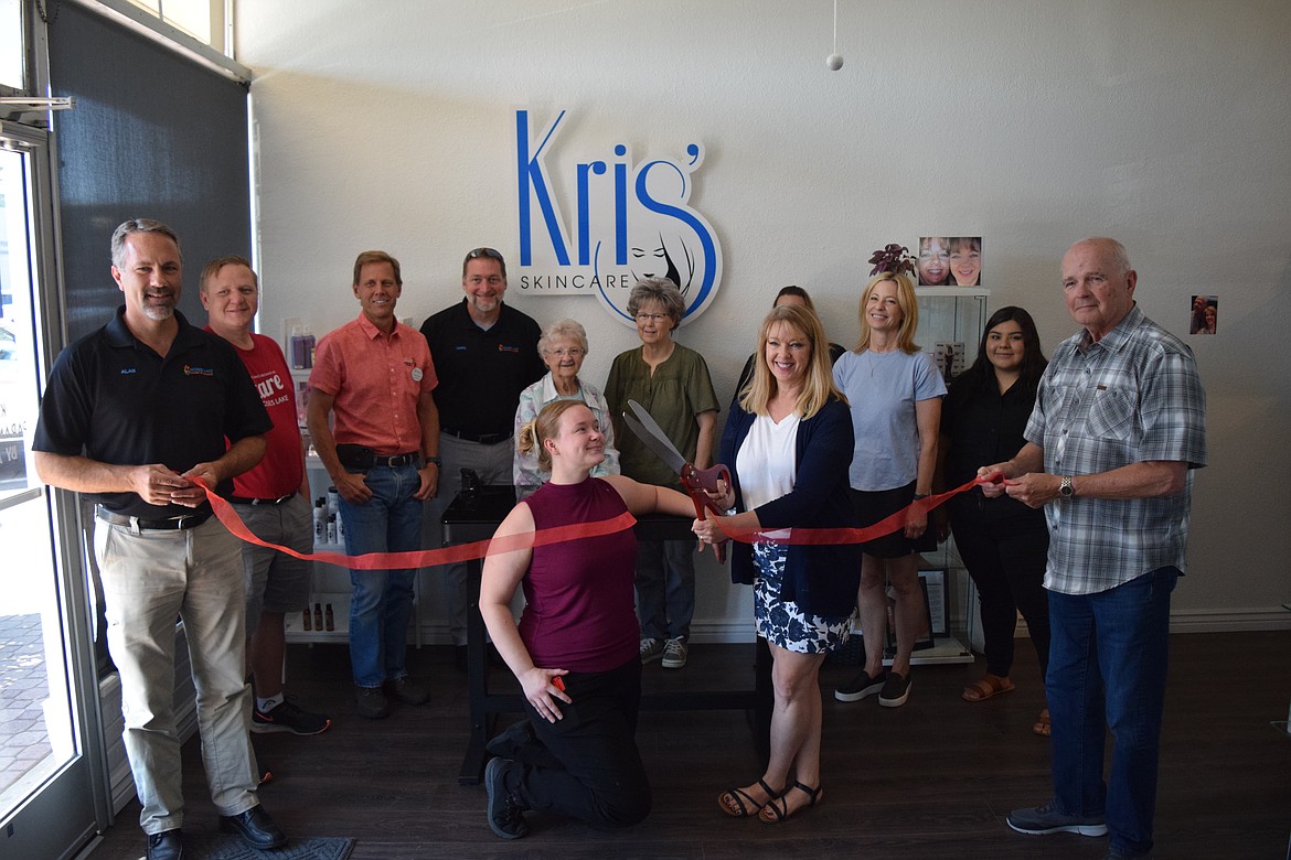 Kris Fisk, the owner of Kris Skin Care, cuts the ribbon on her new business at 216 W. Third Avenue in downtown Moses Lake on Thursday. Fisk said she specializes in treating skin problems, especially difficult ones, like acne, burns and skin restoration for people dealing with cancer. “I don’t do fluffy facials,” she said.