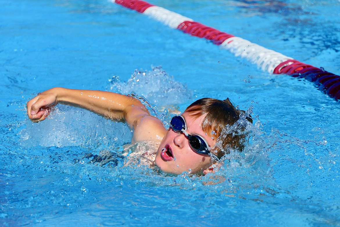 Robby Schuttler, 10, swims a lap in the Logan Health Kids Triathlon at Woodland Park in Kalispell on Saturday, July 16. (Matt Baldwin/Daily Inter Lake)