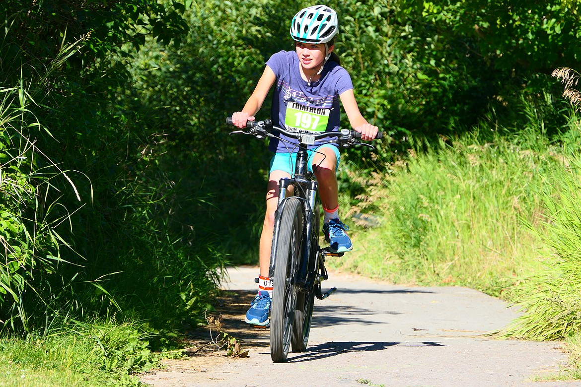 Katrina Bochman, 11, competes in the Logan Health Kids Triathlon at Woodland Park in Kalispell on Saturday, July 16. (Matt Baldwin/Daily Inter Lake)