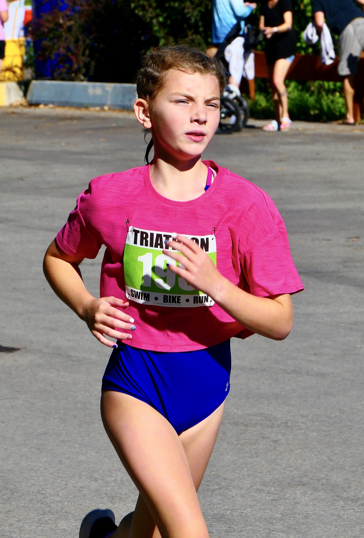 Norah Huff, 11, starts the running portion of the Logan Health Kids Triathlon at Woodland Park in Kalispell on Saturday, July 16. (Matt Baldwin/Daily Inter Lake)