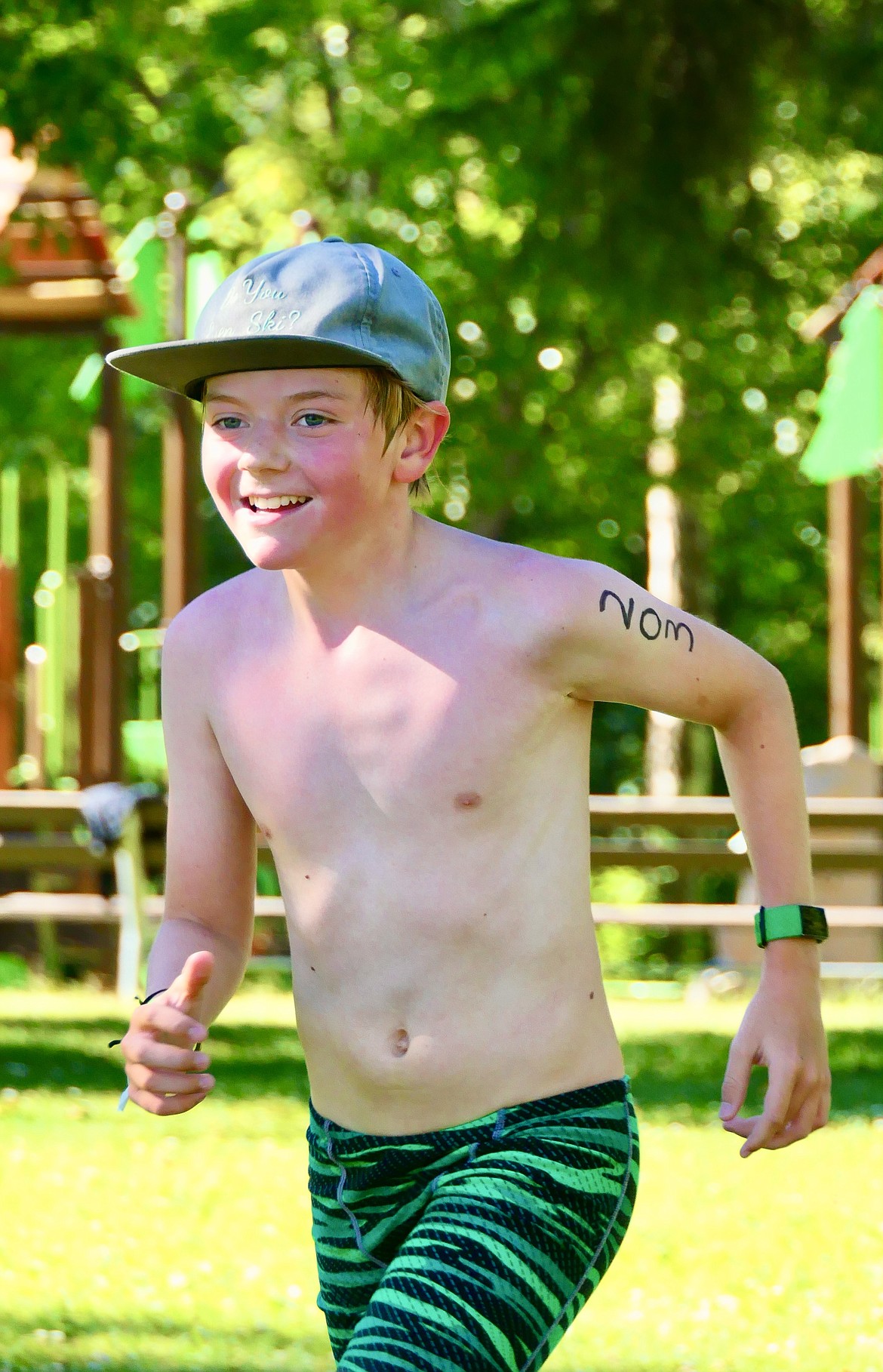 Porter Shehan, 11, approaches the finish of the Logan Health Kids Triathlon at Woodland Park in Kalispell on Saturday, July 16. Sheehan, of Whitefish, finished second overall in his age group. (Matt Baldwin/Daily Inter Lake)