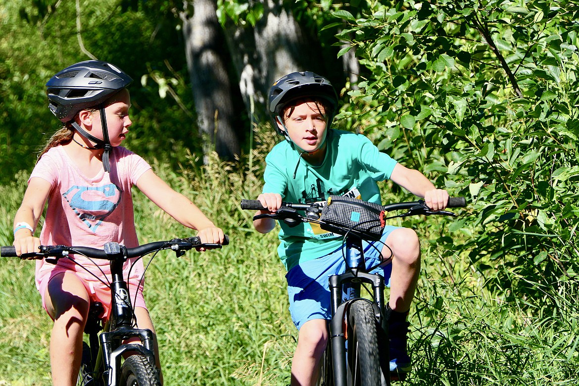 Racers maneuver during the bike portion of the Logan Health Kids Triathlon at Woodland Park in Kalispell on Saturday, July 16. (Matt Baldwin/Daily Inter Lake)