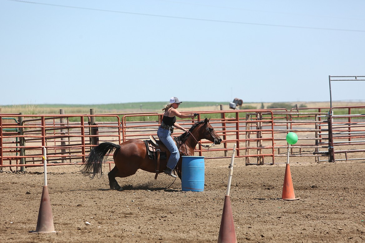 During a run, riders use two Colt .45s with black powder ammunition to shoot balloons in a specified order while riding a horse. The ammunition used has a range of only about 15 feet to ensure safety.