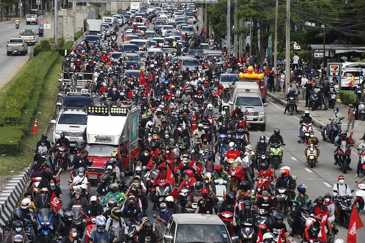 Anti-government protesters block the road with cars and motorcycles as a part of their "car mob" demonstrations along several roads in Bangkok, Thailand, on Aug. 29, 2021. Cybersecurity researchers have found that Thai activists involved in the country’s pro-democracy protests had their cell phones or other devices infected and attacked with spyware. (AP Photo/Anuthep Cheysakron, File)