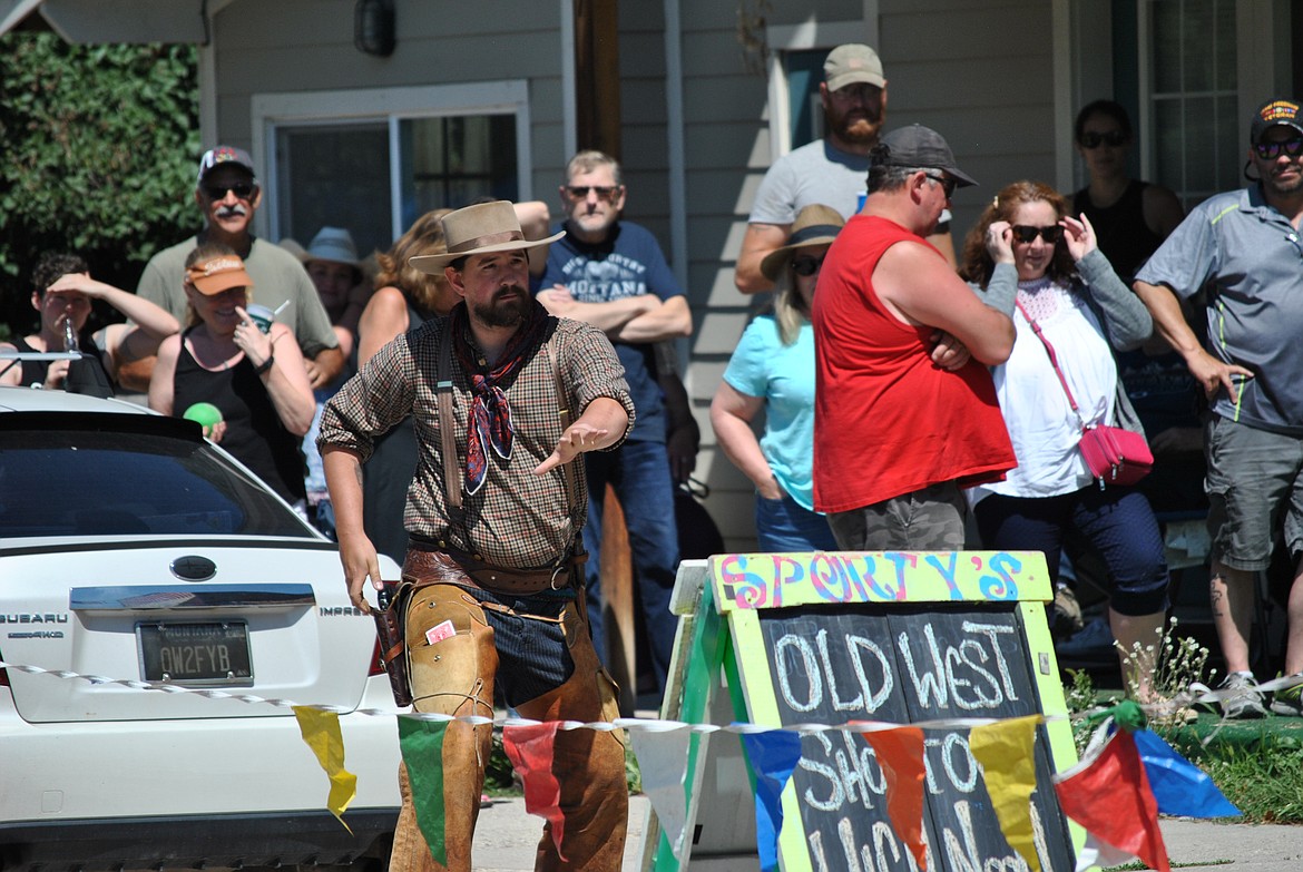 Kenley Zylawy tries to talk himself out of trouble during the Old West High Noon Shootout at the Alberton Railroad Day's in front of the Trax Bar. (Mineral Independent/Amy Quinlivan)