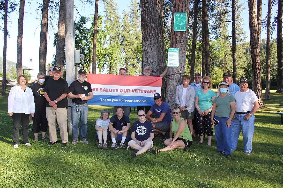 Marine veteran Richard Rivadeneira (leaning against tree) was welcomed at Eva Horning Park by the Mineral County Rails to Trails Committee, VFW and community members on his bicycle route from Washington, D.C. to the Pacific Ocean. (Monte Turner/Mineral Independent)