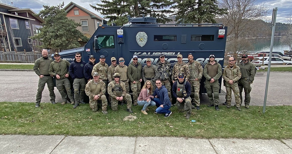 The Northwest Regional SWAT team members with homeowners Tara and Douglas Zimmerman during a training day near City Beach in Whitefish. (Courtesy Photo)