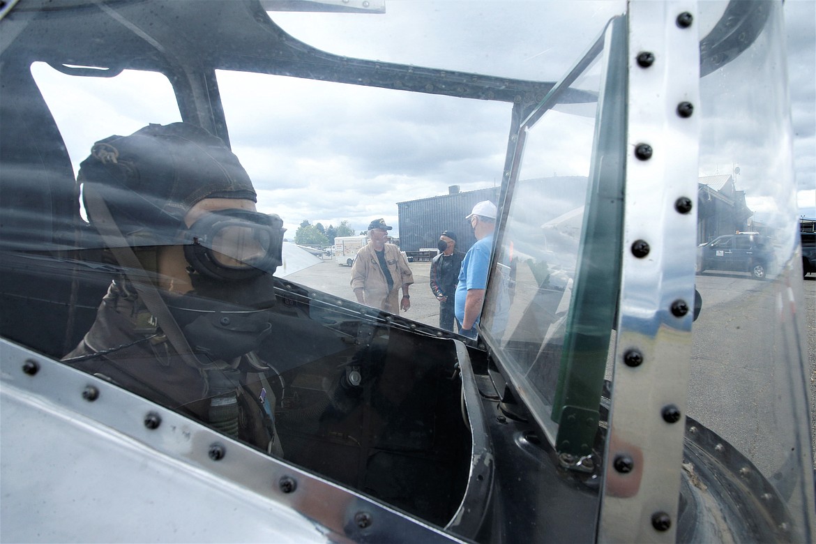 Russ Kozimor talks to guests just outside the tail gunner post of the B-17 on Monday,