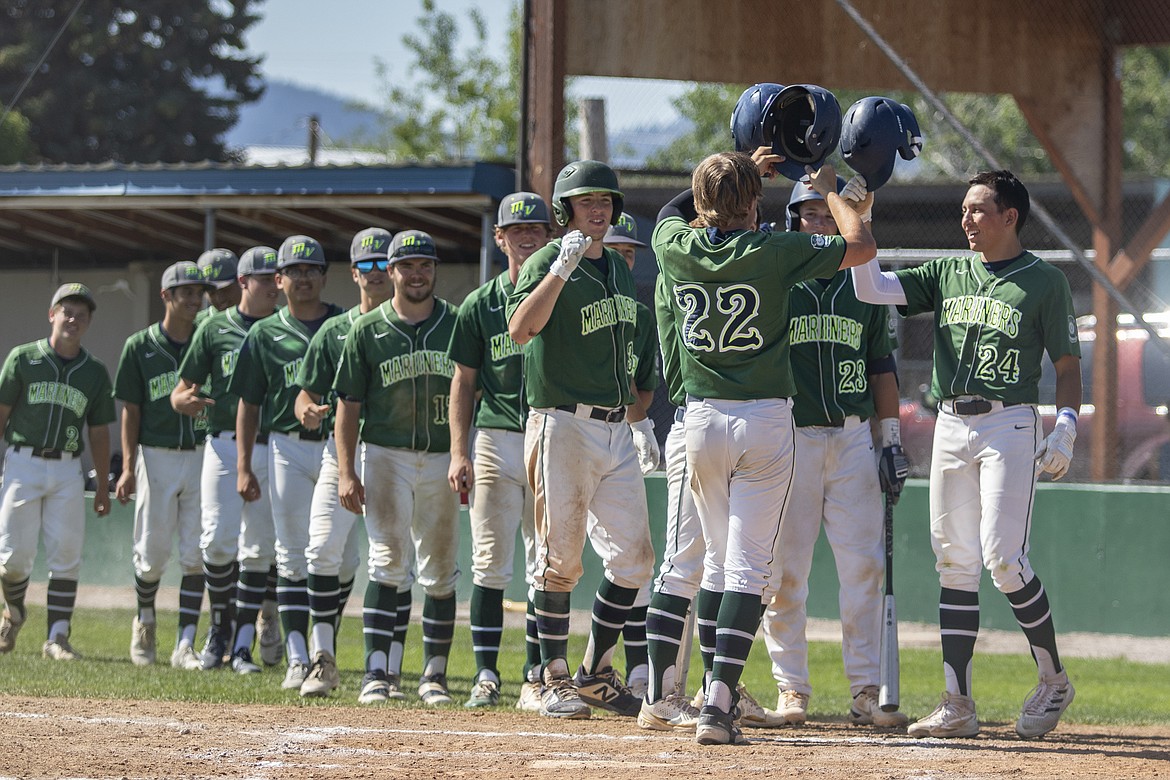 The Mission Valley Mariners celebrate a Dawson Dumont (#22) home run. (Rob Zolman/Lake County Leader)