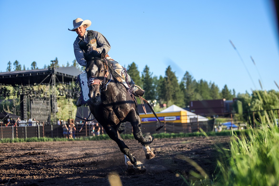 A saddle bronc rider at the rodeo at Under the Big Sky on July 17, 2022. (JP Edge photo)