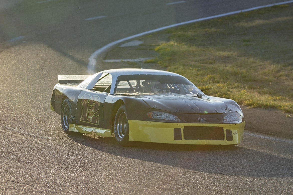 Local racer Cory Wolfe, driver of the #12 car, races down the backstretch during the Montana 200 hosted at the Mission Valley Super Oval on Saturday evening in Pablo. (Rob Zolman/Lake County Leader)