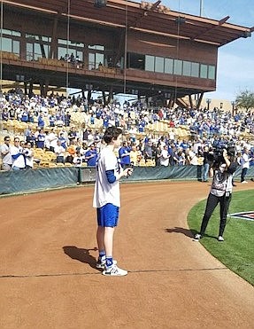 Courtesy photo
Ryan Schneider performs the national anthem before the start of a Los Angeles Dodgers spring training game in Glendale, Ariz., in 2019. It was his fourth time performing the song for the team.