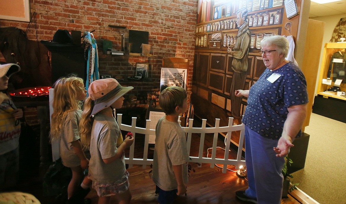 Post Falls Historical Society treasurer Cindy Mead shares information about how pharmacies worked in the past during a Camp Ka-Mee-Lin field trip Tuesday.