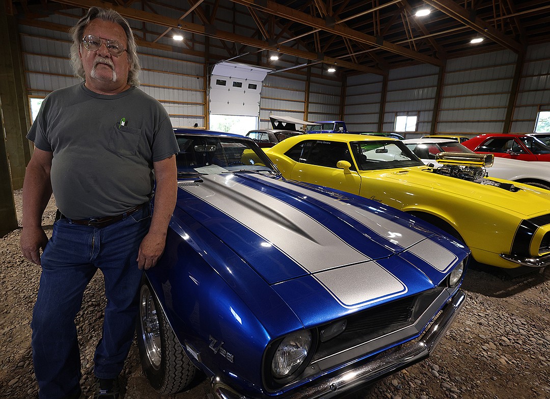 Columbia Falls muscle car collector Donny Stevens rests on his 1968 Camaro, which he has owned for 46 years. (Jeremy Weber/Daily Inter Lake)