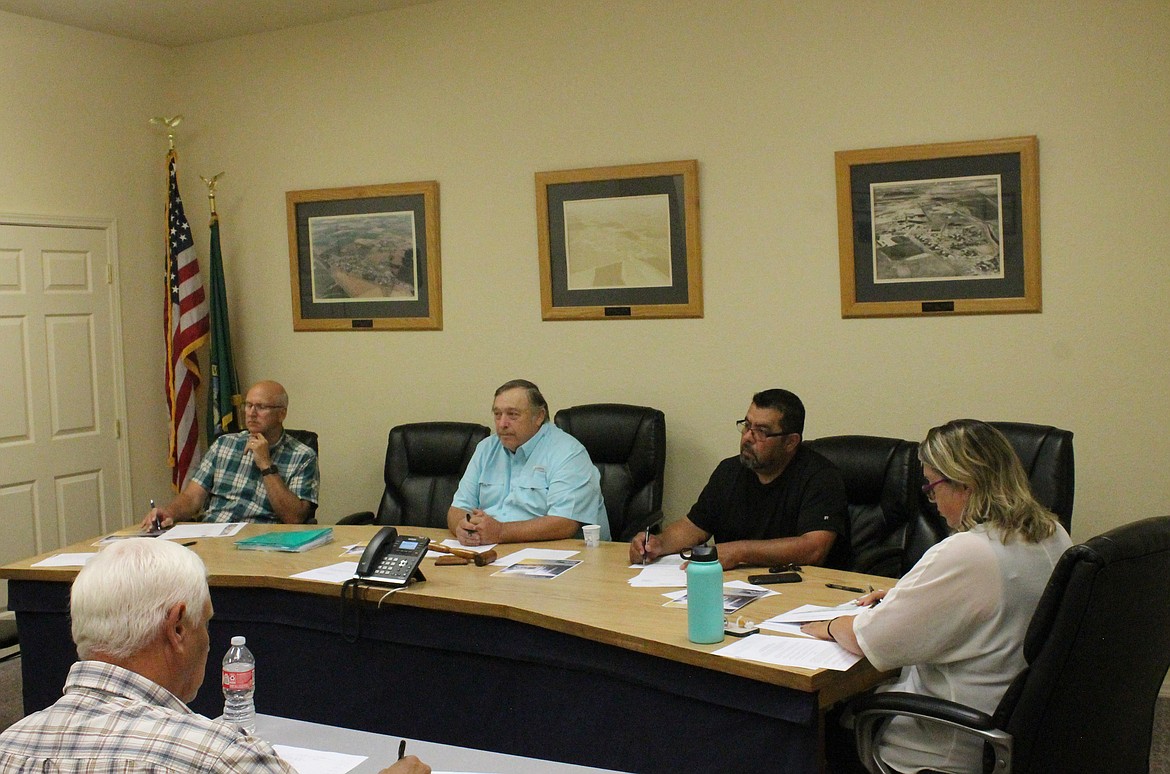 From left: Royal City City Council members Michael Christensen, Mayor Kent Andersen, Hector Rodriguez and Tiffany Workinger discuss the purchase of a new police vehicle Tuesday.