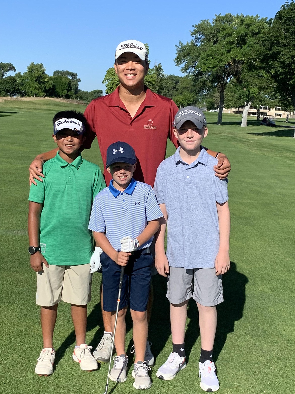 John Kim, back, won the boys 16-18 tournament, shooting a minus-six en route to qualifying for states. He is joined by Franco Luis Salvante, front left, Trip Steinmetz, front middle, and Rhett Braman, front right.