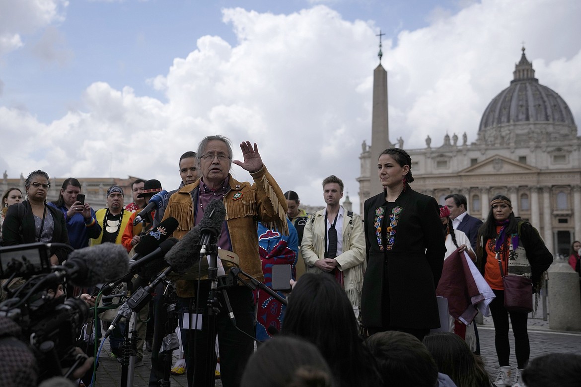 Gerald Antoine, center, First Nations NWT Regional Chief, is flanked by Natan Obed, president of Inuit Tapiriit Kanatami delegation, left, and Cassidy Caron, President of the Metis community, as they meet reporters in St.Peter's Square, at the Vatican, after their meeting with Pope Francis, Friday, April 1, 2022. The restitution of Indigenous and colonial-era artifacts, a pressing debate for museums and national collections across Europe, is one of the many agenda items awaiting Francis on his trip to Canada, which begins Sunday. (AP Photo/Alessandra Tarantino, File)