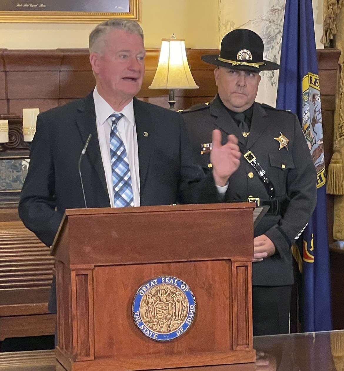 Idaho Republican Gov. Brad Little announces $1 million to fight illegal fentanyl use at the Statehouse in Boise, Idaho, as State Police Colonel Kedrick Wills looks on, Thursday, July 21, 2022. (AP Photo/Keith Ridler)