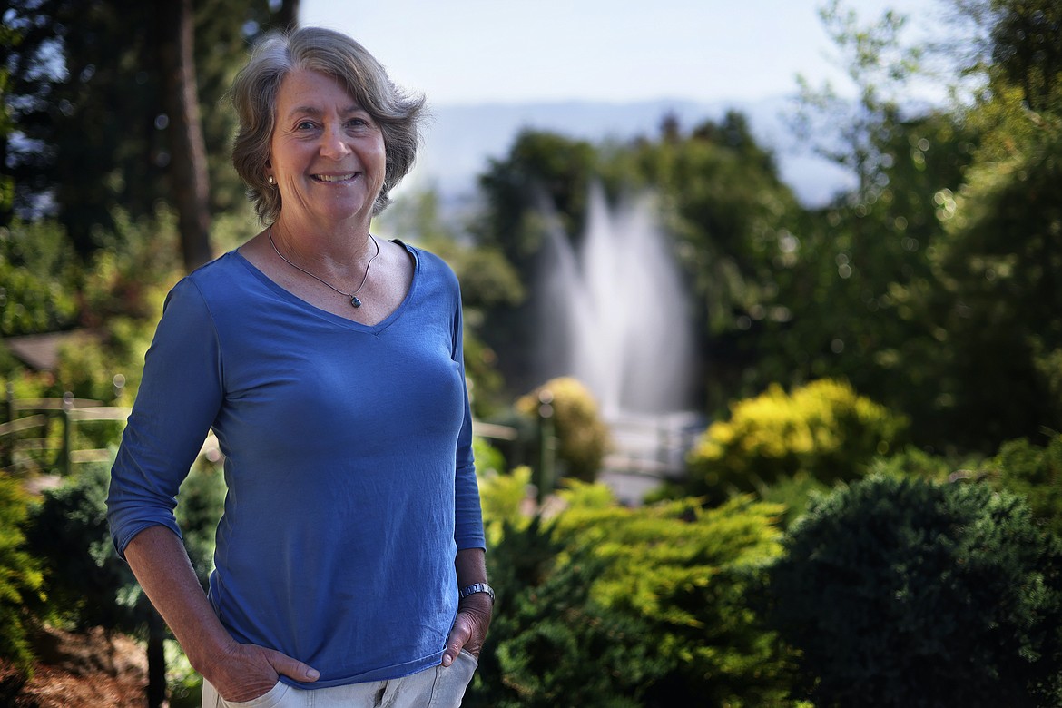 Carol Bibler in the Bibler Gardens at her parents Sam and Jean Bibler's home above Foys Lake on July 21. (Jeremy Weber/Daily Inter Lake)