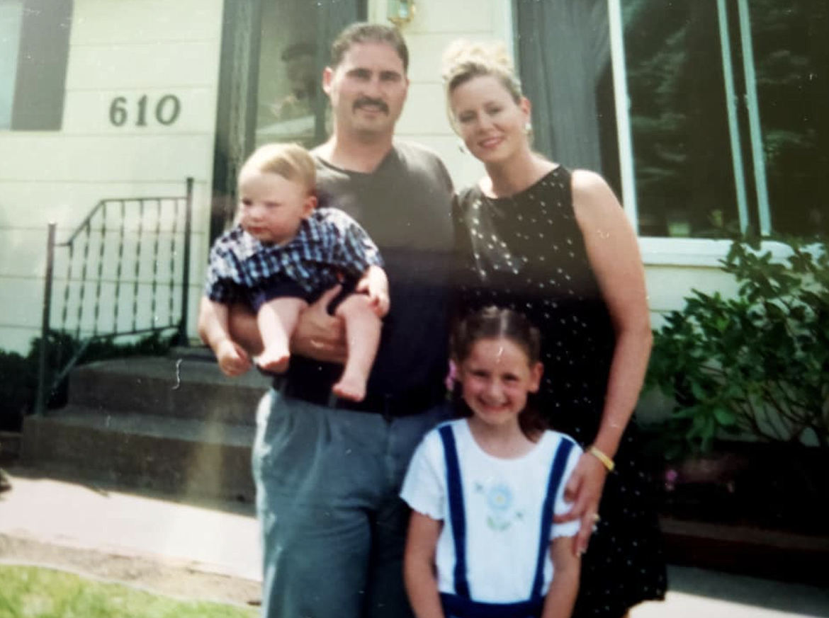 An early family photo of Mitch and Keri Alexander with their son, Mason, and daughter, Abby, in front of their old Pinehurst home.
