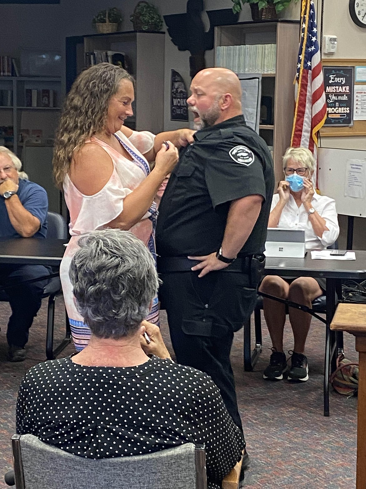 Justin Rowland’s fiancée, Amy Morris, pinned on his badge at the end of his swearing in and Rowland pretended to get poked as she pinned it.