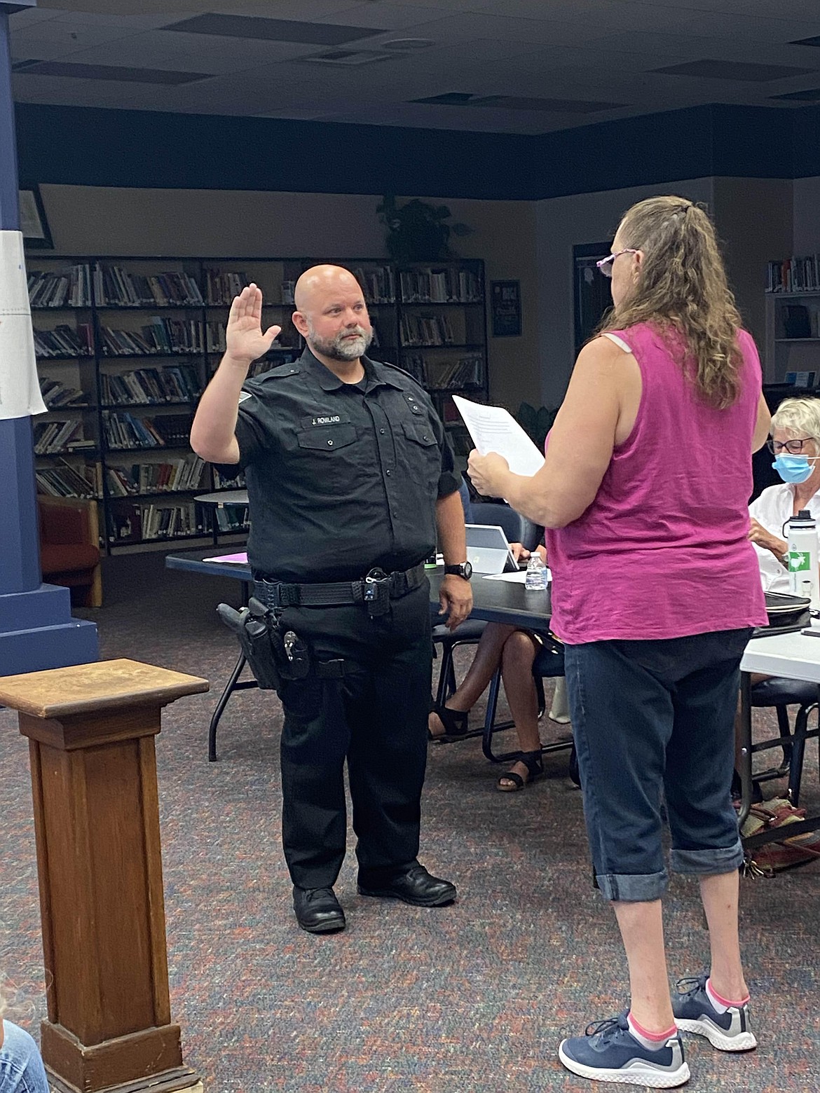 Justin Rowland takes the oath of office to be a full-time police officer for the Soap Lake Police Department with Soap Lake Mayor Michelle Agliano.