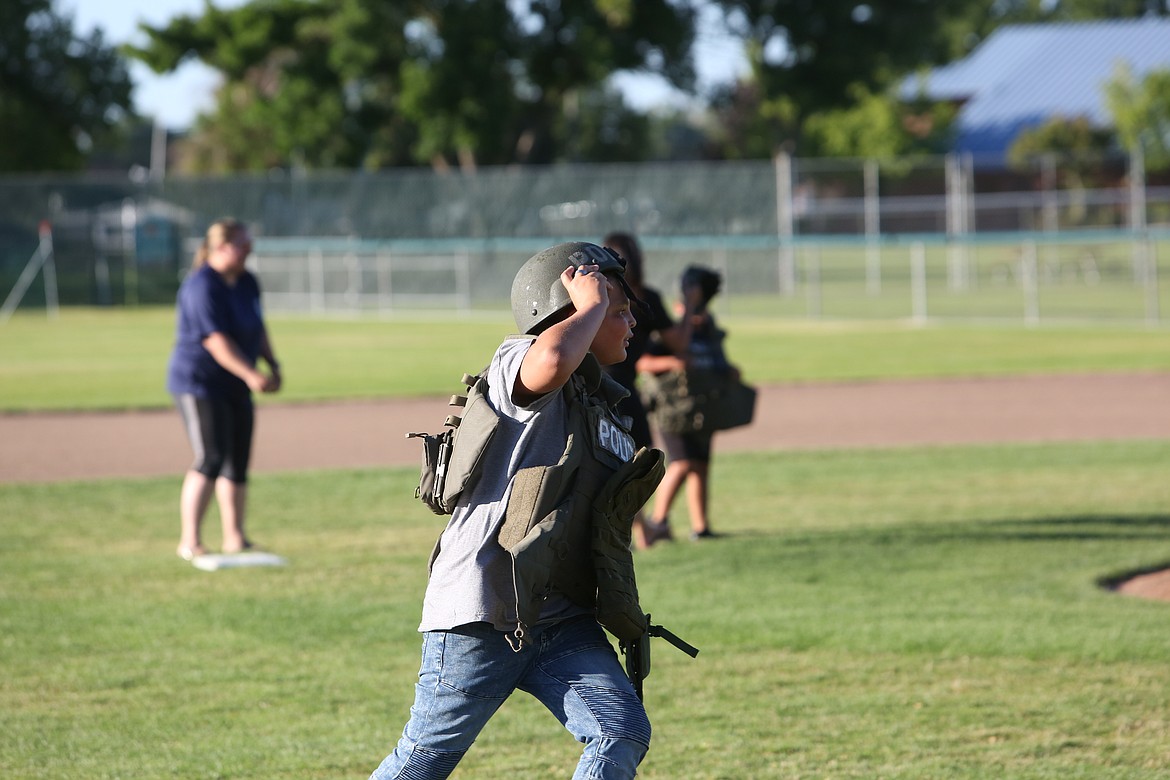 Between innings, spectators could participate in events like a relay in police gear.