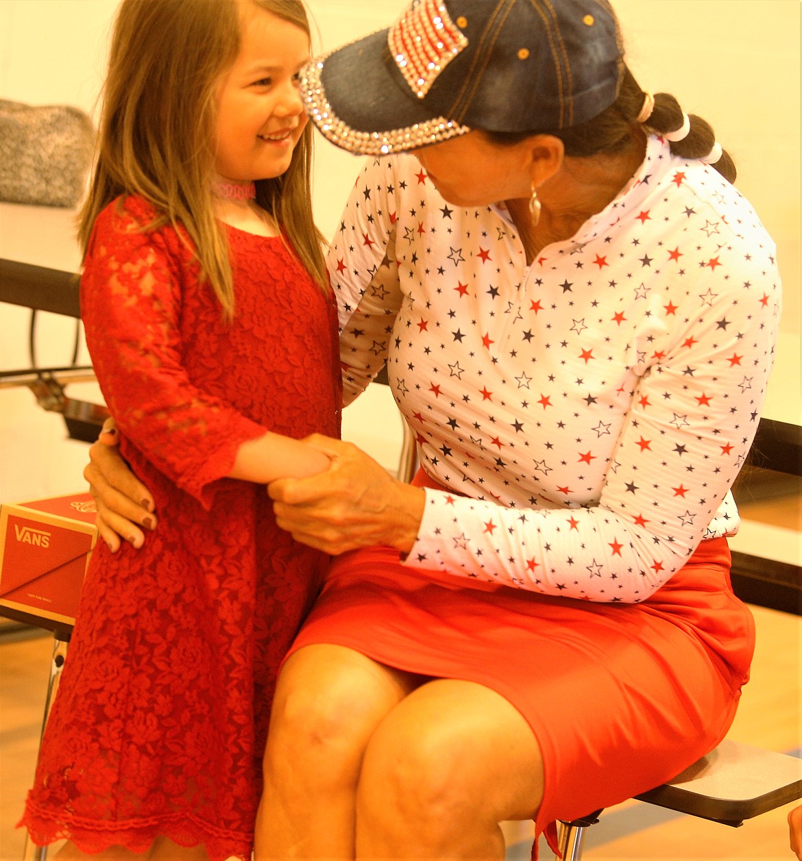 Rita Case chats with Delilah Bailey at the Duane and Lola Hagadone Boys and Girls Club of Kootenai County on Thursday.