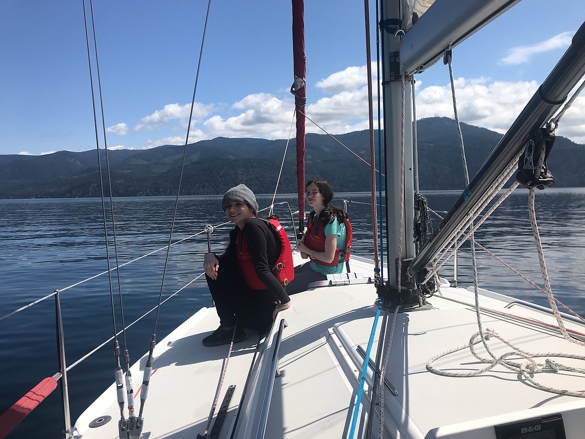 Emma, left, and Michaela Neary enjoy a relaxing break on the Dogsmile sailboat on June 15. The Neary family is one of hundreds of groups and guests who have enjoyed sailing therapy with Dogsmile Adventures since the nonprofit launched in 2020.