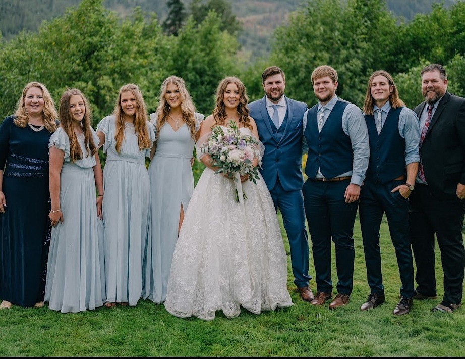 A photo of the Loutzenhiser family at the wedding of oldest son, Josh, and his bride Michelle at the family home last August. "His dream was always to have his wedding at his childhood home," Lauren Loutzenhiser said. "We are grateful he at least got that."