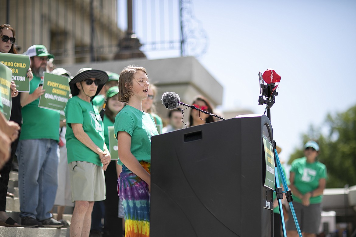 A youth speaks at Reclaim Idaho's petition signature turn-in event at the Idaho capitol building on July 6.