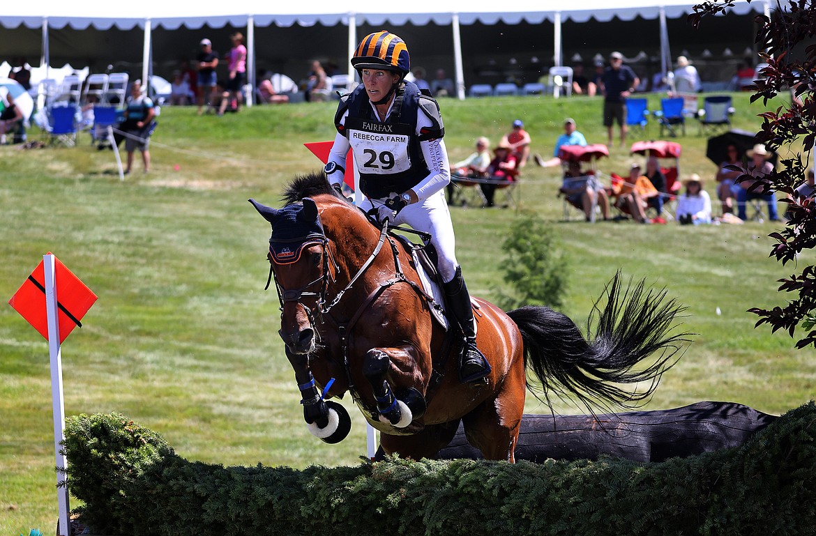Elisabeth Halliday-Sharp rides "Cooley Nutracker" through the second water feature of the three-star long course at The Event at Rebecca Farm July 23. (Jeremy Weber/Daily Inter Lake)