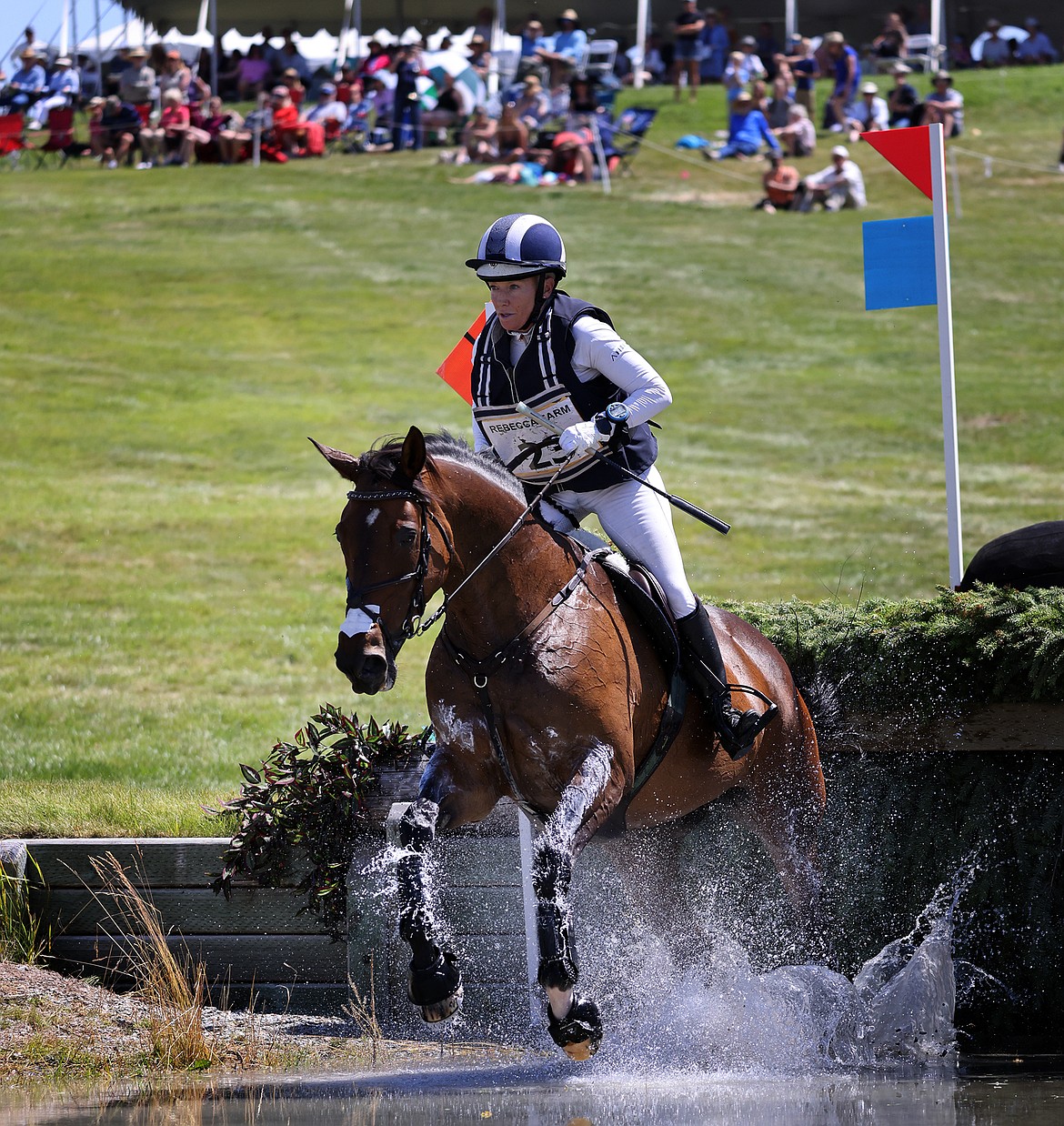 Hawley Bennett-Awad rides "Jollybo" through the second water feature of the three-star long course at The Event at Rebecca Farm July 23. (Jeremy Weber/Daily Inter Lake)