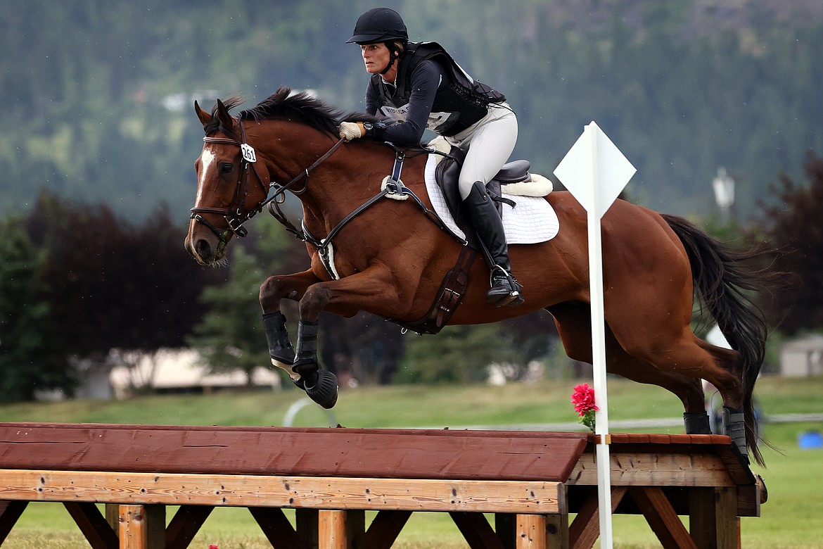 Stephanie Parker atop "Tough Timber" clears an early jump in the Training division of The Event at Rebecca Farm July 22. (Jeremy Weber/Daily Inter Lake)
