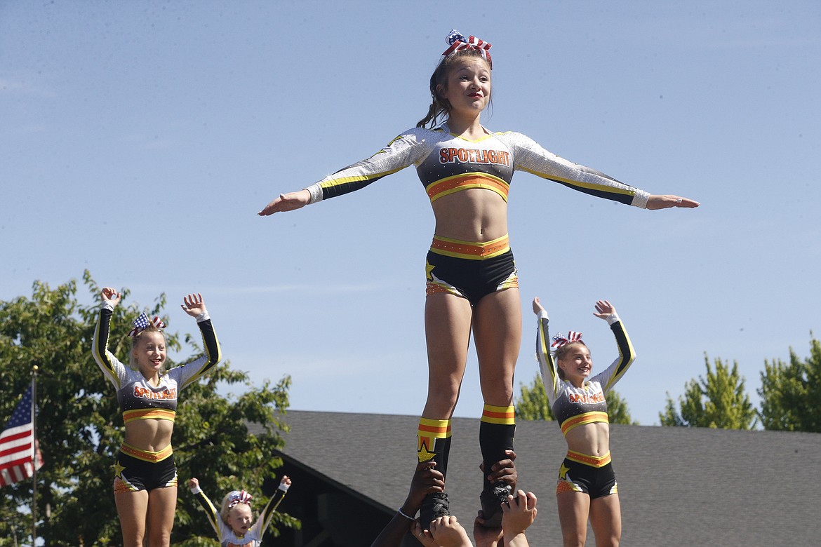 Young athletes from Spotlight Gymnastics wowed the crowd with aerial maneuvers. KAYE THORNBRUGH/Press