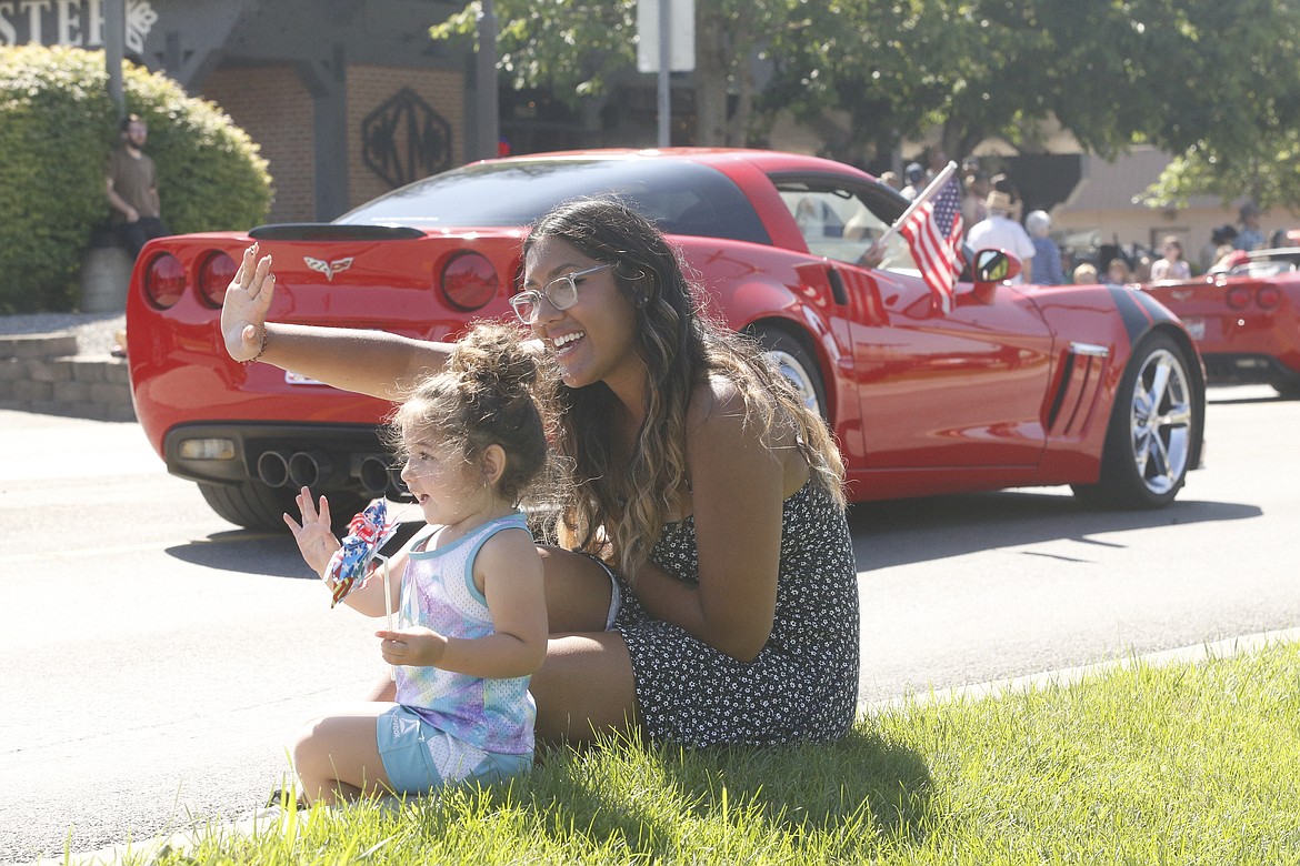 Charlotte Durham, age 2, enjoyed her first parade with her mom, Bree. KAYE THORNBRUGH/Press