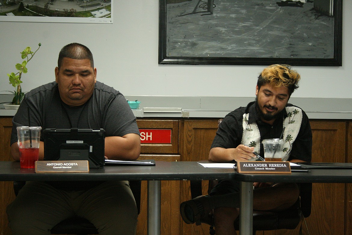 Mattawa City Council members Tony Acosta, left, and Alex Heredia, right, listen during a discussion of adult entertainment regulations at the council’s meeting Thursday.