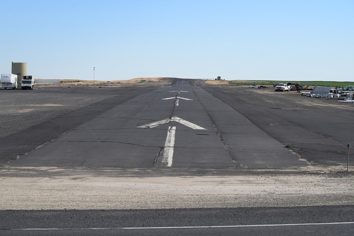 The roughly 2,800-foot-long runway of the Warden Airport, looking south. Currently, aircraft taking off in this direction veer to the left, over the growing city of Warden. However, port commissioners voted to submit an application to the Federal Aviation Administration to change the south-bound take-off pattern to the right, guiding aircraft over farmland instead.